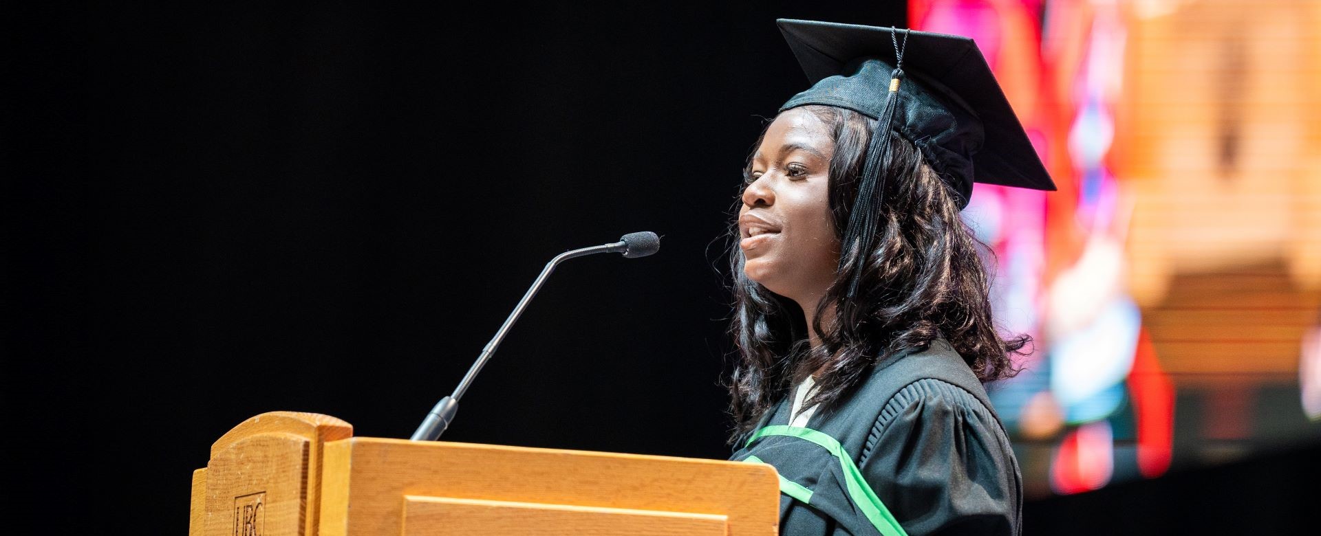 Graduate Oluwaseun Akinloye speaking at the 2024 convocation ceremony.