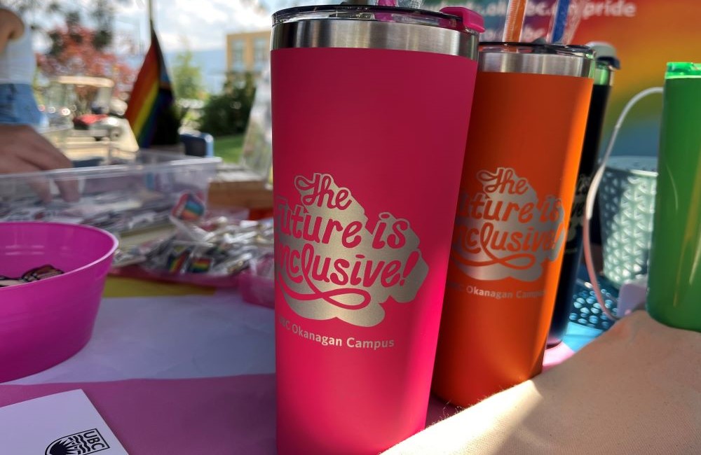 Close up of UBC Okanagan drink tumblers that say The Future is Inclusive